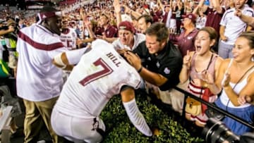 Aug 28, 2014; Columbia, SC, USA; Texas A&M Aggies quarterback Kenny Hill (7) is congratulated by fans as they celebrate their win over the South Carolina Gamecocksat Williams-Brice Stadium. Mandatory Credit: Jeff Blake-USA TODAY Sports