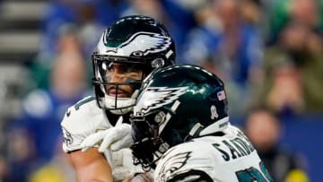 Philadelphia Eagles quarterback Jalen Hurts (1) hands off to Philadelphia Eagles running back Miles Sanders (26) on Sunday, Nov. 20, 2022, during a game against the Indianapolis Colts at Lucas Oil Stadium in Indianapolis.