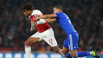 LONDON, ENGLAND - JANUARY 29: Alex Iwobi of Arsenl is challenged by Lee Peltier of Cardiff City during the Premier League match between Arsenal and Cardiff City at Emirates Stadium on January 29, 2019 in London, United Kingdom. (Photo by Catherine Ivill/Getty Images)