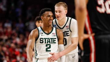 Michigan State guard Tyson Walker (2) talks to forward Joey Hauser (10) after a play against Davidson during the second half of Michigan State's 74-73 victory over Davidson in the first round of the NCAA tournament at Bon Secours Wellness Arena in Greenville, S.C. on Friday, March 18, 2022.