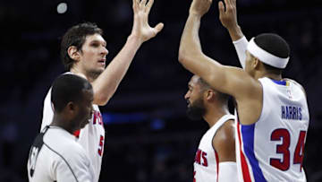 Jan 5, 2017; Auburn Hills, MI, USA; Detroit Pistons center Boban Marjanovic (51) celebrates with Detroit Pistons forward Tobias Harris (34) and guard Darrun Hilliard (middle) during the third quarter at The Palace of Auburn Hills. Pistons won 115-114. Mandatory Credit: Raj Mehta-USA TODAY Sports