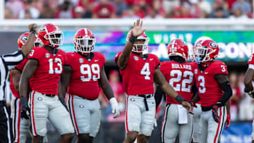 ATHENS, GA - OCTOBER 8: Nolan Smith #4 of the Georgia Bulldogs waves t the crowd after celebrating a big tackle during a game between Auburn Tigers and Georgia Bulldogs at Sanford Stadium on October 8, 2022 in Athens, Georgia. (Photo by Steve Limentani/ISI Photos/Getty Images)