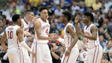March 24, 2016; Anaheim, CA, USA; Oklahoma Sooners guard Jordan Woodard (10), forward Ryan Spangler (00), guard Buddy Hield (24) and guard Christian James (3) huddle before play against Texas A&M Aggies during the second half of the semifinal game in the West regional of the NCAA Tournament at Honda Center. Mandatory Credit: Robert Hanashiro-USA TODAY Sports