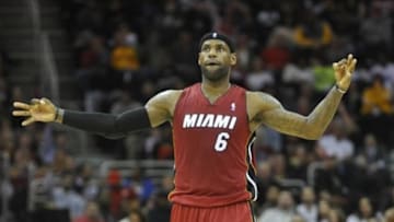 Mar 18, 2014; Cleveland, OH, USA; Miami Heat forward LeBron James (6) reacts after a three-point basket by guard Ray Allen (not pictured) in the second quarter at Quicken Loans Arena. Mandatory Credit: David Richard-USA TODAY Sports