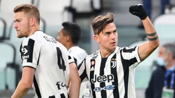 Juventus' Argentine forward Paulo Dybala (R) celebrates after scoring his side's second goal during the Italian Serie A football match between Juventus and Genoa on December 5, 2021 at the Juventus stadium in Turin. (Photo by Isabella BONOTTO / AFP) (Photo by ISABELLA BONOTTO/AFP via Getty Images)