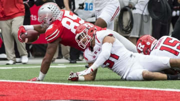 Oct 1, 2016; Columbus, OH, USA; Ohio State Buckeyes tight end Marcus Baugh (85) scores in spite of attempts by Rutgers Scarlet Knights defensive back Anthony Cioffi (31) and linebacker Trevor Morris (15) at Ohio Stadium. Mandatory Credit: Greg Bartram-USA TODAY Sports