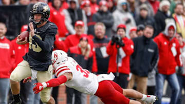 WEST LAFAYETTE, IN - NOVEMBER 02: Jack Plummer #13 of the Purdue Boilermakers runs the ball as Collin Miller #31 of the Nebraska Cornhuskers reaches for the tackle at Ross-Ade Stadium on November 2, 2019 in West Lafayette, Indiana. (Photo by Michael Hickey/Getty Images)