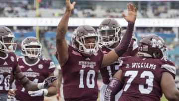 JACKSONVILLE, FL - DECEMBER 30: Mississippi State Bulldogs quarterback Keytaon Thompson (10) celebrates his touchdown run during the first half of the TaxSlayer Bowl game between the Louisville Cardinals and the Mississippi State Bulldogs on December 30, 2017, at Everbank Field in Jacksonville, FL. (Photo by Roy K. Miller/Icon Sportswire via Getty Images)