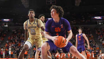 Jan 24, 2023; Clemson, South Carolina, USA; Clemson Tigers forward Ian Schieffelin (4) moves to the basket against Georgia Tech Yellow Jackets forward Jalon Moore (14) during the second half at Littlejohn Coliseum. Mandatory Credit: Ken Ruinard-USA TODAY Sports