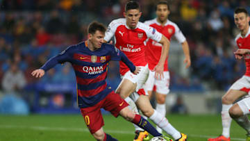 BARCELONA, SPAIN - MARCH 16: Lionel Messi of FC Barcelona and Gabriel Paulista of Arsenal during the UEFA Champions League match between FC Barcelona and Arsenal at Camp Nou on March 16, 2016 in Barcelona, Spain. (Photo by Catherine Ivill - AMA/Getty Images)