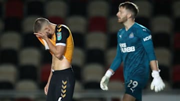 Newport County's Brandon Cooper reacts after missing. (Photo by ALEX PANTLING/POOL/AFP via Getty Images)