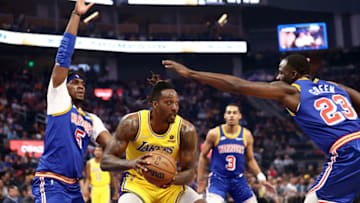 SAN FRANCISCO, CALIFORNIA - APRIL 07: Dwight Howard #39 of the Los Angeles Lakers is guarded by Kevon Looney #5 and Draymond Green #23 of the Golden State Warriors in the first half at Chase Center on April 07, 2022 in San Francisco, California. NOTE TO USER: User expressly acknowledges and agrees that, by downloading and/or using this photograph, User is consenting to the terms and conditions of the Getty Images License Agreement. (Photo by Ezra Shaw/Getty Images)