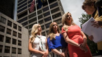 NEW YORK, NY - JUNE 4: (L to R) Former Houston Texans cheerleaders Hannah Turnbow, Ainsley Parish and Kelly Neuner confer with attorney Gloria Allred (Photo by Drew Angerer/Getty Images)