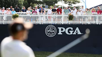 ST. LOUIS, MO - AUGUST 06: A golfer plays a shot on the practice range as fans looks on during a practice round prior to the 2018 PGA Championship at Bellerive Country Club on August 6, 2018 in St. Louis, Missouri. (Photo by Jamie Squire/Getty Images)