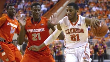 Jan 17, 2015; Clemson, SC, USA; Clemson Tigers guard Damarcus Harrison (21) drives to the basket while being defended by Syracuse Orange forward Tyler Roberson (21) during the second half at Littlejohn Coliseum. Mandatory Credit: Joshua S. Kelly-USA TODAY Sports
