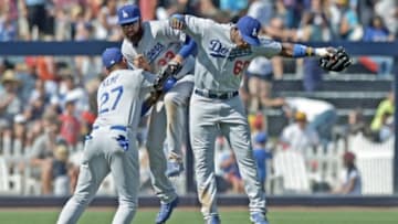 Jun 22, 2014; San Diego, CA, USA; Los Angeles Dodgers center fielder Matt Kemp (27), left fielder Scott Van Slyke (33), and right fielder Yasiel Puig (66) celebrate after defeating the San Diego Padres 2-1 at Petco Park. Mandatory Credit: Jake Roth-USA TODAY Sports