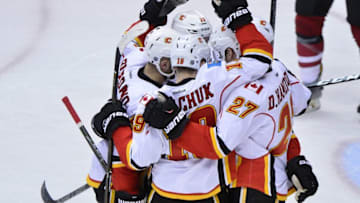 Dec 19, 2016; Glendale, AZ, USA; Calgary Flames center Mikael Backlund (11) celebrates with teammates after scoring a power play goal in the second period against the Arizona Coyotes at Gila River Arena. Mandatory Credit: Matt Kartozian-USA TODAY Sports