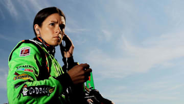 LOUDON, NH - AUGUST 13: Danica Patrick driver of the #7 Team GoDaddy Andretti Autosport Dallara Honda stands in pit lane during practice for the IZOD IndyCar Series MoveThatBlock.com Indy 225 at New Hampshire Motor Speedway on August 13, 2011 in Loudon, New Hampshire. (Photo by Nick Laham/Getty Images)