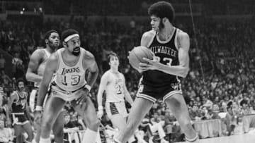 Inglewood, Calif.: Two of basketball's giants stare at each other as Milwaukee Buck Lew Alcindor tries to decide if he should go over Los Angeles Laker Wilt Chamberlain or pass the ball off during early action of the third game of the second round of the NBA Playoffs. Alcindor tried to go over the Laker big man and missed the shot.