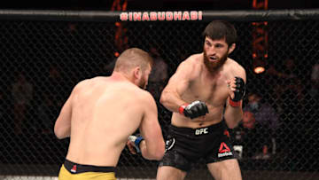 ABU DHABI, UNITED ARAB EMIRATES - OCTOBER 24: In this handout image provided by UFC, (R-L) Magomed Ankalaev of Russia punches Ion Cutelaba of Moldova in their light heavyweight bout during the UFC 254 event on October 24, 2020 on UFC Fight Island, Abu Dhabi, United Arab Emirates. (Photo by Josh Hedges/Zuffa LLC via Getty Images)