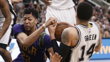Feb 3, 2016; San Antonio, TX, USA; San Antonio Spurs shooting guard Danny Green (14) and New Orleans Pelicans power forward Anthony Davis (23) battle for a loose ball during the second half at AT&T Center. Mandatory Credit: Soobum Im-USA TODAY Sports