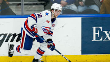 SYRACUSE, NY - APRIL 22: Isak Rosen #18 of Rochester Americans moves the puck against the Syracuse Crunch during Game 2 of the north division semifinals of the Calder Cup Playoffs at Upstate Medical University Arena on April 22, 2023 in Syracuse, New York. (Photo by Isaiah Vazquez/Getty Images)