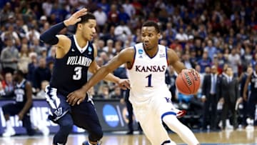 Mar 26, 2016; Louisville, KY, USA; Kansas Jayhawks guard Wayne Selden Jr. (1) drives to the basket against Villanova Wildcats guard Josh Hart (3) of the south regional final of the NCAA Tournament at KFC YUM!. Mandatory Credit: Aaron Doster-USA TODAY Sports