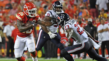 KANSAS CITY, MO - AUGUST 09: Running back Damien Williams #26 of the Kansas City Chiefs rushes up field during the second half against defensive back Kurtis Drummond #23 of the Houston Texans on August 9, 2018 at Arrowhead Stadium in Kansas City, Missouri. (Photo by Peter Aiken/Getty Images)