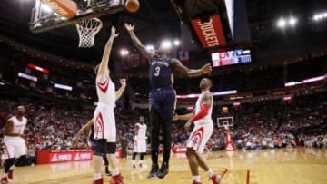 Apr 12, 2014; Houston, TX, USA; New Orleans Pelicans guard Anthony Morrow (3) shoots the ball over Houston Rockets center Omer Asik (left) during the first half at Toyota Center. Mandatory Credit: Soobum Im-USA TODAY Sports
