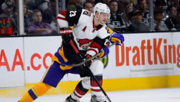 Nov 10, 2015; Los Angeles, CA, USA; Los Angeles Kings center Trevor Lewis (22) defends Arizona Coyotes defenseman Oliver Ekman-Larsson (23) in the second period of the game at Staples Center. Mandatory Credit: Jayne Kamin-Oncea-USA TODAY Sports