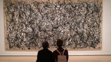 NEW YORK, NY - DECEMBER 30: Viewers look at an abstract expressionist painting by artist Jackson Pollock titled "One: Number 31, 1950" on December 30, 2020 at the Museum of Modern Art in New York City. Museum of Modern Art goers must now reserve their entrance tickets on-line for a specific day. (Photo by Robert Nickelsberg/Getty Images)