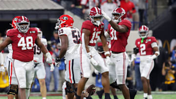 INDIANAPOLIS, INDIANA - JANUARY 10: Dallas Turner #15 and Will Anderson Jr. #31 of the Alabama Crimson Tide react after a sack in the second quarter against the Georgia Bulldogs during the 2022 CFP National Championship Game at Lucas Oil Stadium on January 10, 2022 in Indianapolis, Indiana. (Photo by Kevin C. Cox/Getty Images)