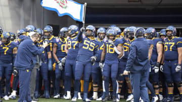 MEMPHIS, TENNESSEE - DECEMBER 31: The West Virginia Mountaineers team prepares to run onto the field before a game against Army Black Knights at Liberty Bowl Memorial Stadium on December 31, 2020 in Memphis, Tennessee. The Mountaineers defeated the Black Knights 24-21. (Photo by Wesley Hitt/Getty Images)