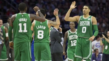 PHILADELPHIA, PA - OCTOBER 20: Jayson Tatum #0 of the Boston Celtics high fives Kyrie Irving #11 and Shane Larkin #8 in the fourth quarter against the Philadelphia 76ers at the Wells Fargo Center on October 20, 2017 in Philadelphia, Pennsylvania. The Celtics defeated the 76ers 102-92. NOTE TO USER: User expressly acknowledges and agrees that, by downloading and or using this photograph, User is consenting to the terms and conditions of the Getty Images License Agreement. (Photo by Mitchell Leff/Getty Images)