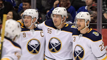 Nov 30, 2019; Toronto, Ontario, CAN; Buffalo Sabres forward Rasmus Ristolainen (55) celebrates a goal against Toronto Maple Leafs with forwards Jack Eichel (9) and Sam Reinhart (23) in the third period at Scotiabank Arena. Mandatory Credit: Dan Hamilton-USA TODAY Sports