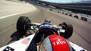 FORT WORTH, TX - JUNE 08: Mario Andretti drives Travis Pastrana in a two-seater IndyCar at Texas Motor Speedway on June 8, 2012 in Fort Worth, Texas. (Photo by Donald Miralle/Getty Images for Texas Motor Speedway)