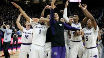 Feb 6, 2016; Manhattan, KS, USA; Members of the Kansas State Wildcats basketball team celebrate a win against the Oklahoma Sooners at Fred Bramlage Coliseum. The Wildcats won the game, 80-69. Mandatory Credit: Scott Sewell-USA TODAY Sports