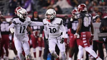 Jacob Dingle of the Cincinnati Bearcats celebrates with Justin Harris after intercepting a pass against AAC opponent Temple Owls. Getty Images.
