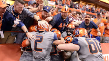 Oct 15, 2016; Syracuse, NY, USA; Syracuse Orange fans and players celebrate a touchdown by running back Dontae Strickland during the fourth quarter of a game against the Virginia Tech Hokies at the Carrier Dome. Syracuse won 31-17. Mandatory Credit: Mark Konezny-USA TODAY Sports