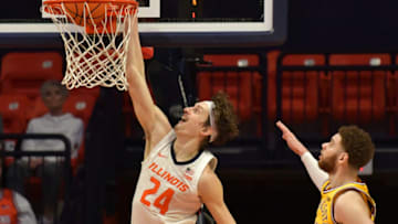 Feb 20, 2023; Champaign, Illinois, USA; Illinois Fighting Illini forward Matthew Mayer (24) dunks the ball as Minnesota Golden Gophers forward Jamison Battle (10) looks on during the second half at State Farm Center. Mandatory Credit: Ron Johnson-USA TODAY Sports