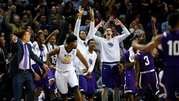 NEW YORK, NY - MARCH 18: Jared Johnson #3 of the Stephen F. Austin Lumberjacks celebrates with his bench in the second half against the West Virginia Mountaineers during the first round of the 2016 NCAA Men's Basketball Tournament at Barclays Center on March 18, 2016 in the Brooklyn borough of New York City. (Photo by Elsa/Getty Images)