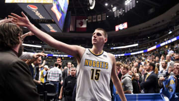 DENVER, CO - APRIL 9: Nikola Jokic (15) of the Denver Nuggets high fives fans as he walks off the court after the second half of the Nuggets' 88-82 win over the Portland Trail Blazers on Monday, April 9, 2018. (Photo by AAron Ontiveroz/The Denver Post via Getty Images)