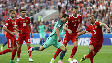 MOSCOW, RUSSIA - JUNE 21: Cedric of Portugal attempts to shoot while he is closed down by the Russia defence during the FIFA Confederations Cup Russia 2017 Group A match between Russia and Portugal at Spartak Stadium on June 21, 2017 in Moscow, Russia. (Photo by Francois Nel/Getty Images)
