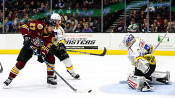 CLEVELAND, OH - NOVEMBER 22: Chicago Wolves center Brandon Pirri (27) shots the puck against Cleveland Monsters goalie Veini Vehvilainen (35) as Cleveland Monsters left wing Marko Dano (56) defends during the third period of the American Hockey League game between the Chicago Wolves and Cleveland Monsters on November 22,2019, at Rocket Mortgage FieldHouse in Cleveland, OH.(Photo by Frank Jansky/Icon Sportswire via Getty Images)