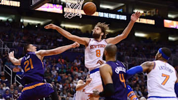 Mar 9, 2016; Phoenix, AZ, USA; New York Knicks center Robin Lopez (8) blocks the shot by Phoenix Suns center Alex Len (21) in the first half at Talking Stick Resort Arena. Mandatory Credit: Jennifer Stewart-USA TODAY Sports