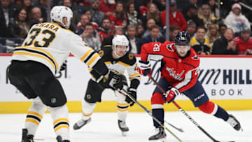 WASHINGTON, DC - DECEMBER 11: Brendan Leipsic #28 of the Washington Capitals skates in front of Zdeno Chara #33 of the Boston Bruins during the second period at Capital One Arena on December 11, 2019 in Washington, DC. (Photo by Patrick Smith/Getty Images)