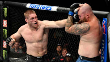 VANCOUVER, BRITISH COLUMBIA - SEPTEMBER 14: (L-R) Todd Duffee punches Jeff Hughes in their heavyweight bout during the UFC Fight Night event at Rogers Arena on September 14, 2019 in Vancouver, Canada. (Photo by Jeff Bottari/Zuffa LLC/Zuffa LLC)