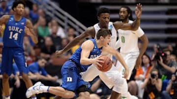 March 24, 2016; Anaheim, CA, USA; Duke Blue Devils guard Grayson Allen (3) moves the ball against Oregon Ducks forward Jordan Bell (1) during the second half of the semifinal game in the West regional of the NCAA Tournament at Honda Center. Mandatory Credit: Robert Hanashiro-USA TODAY Sports