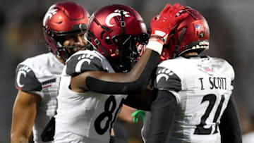 Cincinnati Bearcats wide receiver Tyler Scott celebrates with wide receiver Chris Scott against UCF Knights. USA Today.