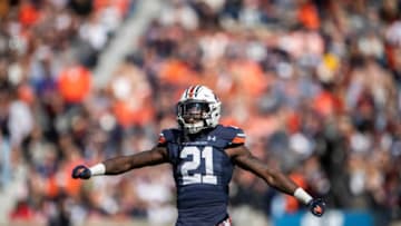 Auburn football safety Smoke Monday (21) celebrates a big hit as Auburn Tigers take on Mississippi State Bulldogs at Jordan-Hare Stadium in Auburn, Ala., on Saturday, Nov. 13, 2021. Mississippi State Bulldogs defeated Auburn Tigers 43-34.